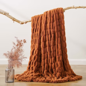 Fluffy orange throw blanket.