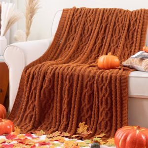 Knitted orange throw blanket for fall home decor must haves.
