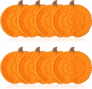 Knitted pumpkin drink coasters for fall home decor must haves.