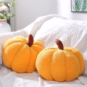 Pumpkin shaped pillows.
